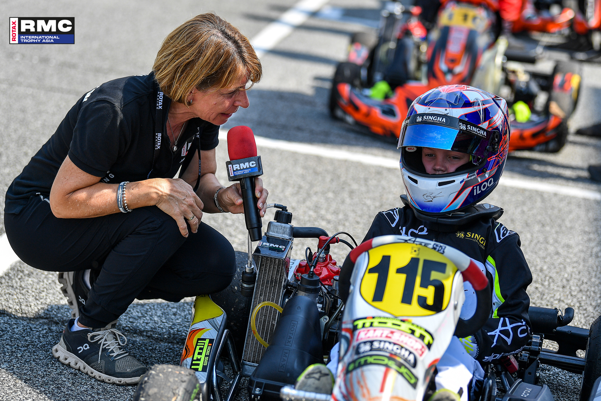 RMCIT Asia Jen talking with Mini MAX Driver Robin Raikkonen at the starting grid